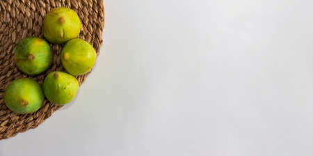 Banner with figs and walnuts on white background. Harvest time in the urban garden. Copy space. Selective focus.の写真素材
