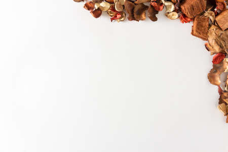 Background of fruits and dry autumn leaves. Copy space. Selective focus.の写真素材