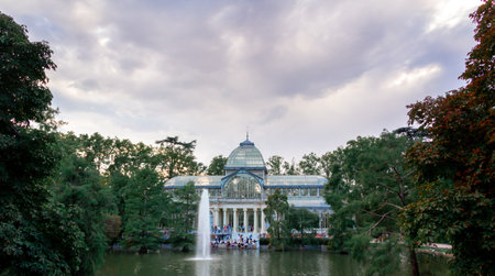 Madrid, Spain; September 17, 2021: Exotic victorian building on pond. Crystal Palace in the Retiro Park in Madrid. Selective focus.のeditorial素材