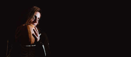 Young woman in halloween skeleton costume holding pumpkin. Night of the dead. Copy space. Selective focus.の写真素材