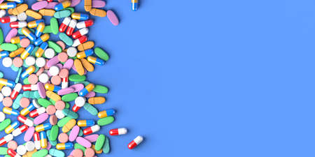 Medicine tablets and capsules on blue background. Health care concept. Copy space. 3D illustration.