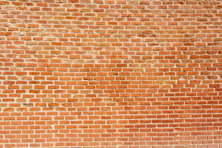 Orange brick wall background.