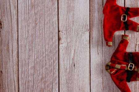 Santa Claus clothes on wooden background. Copy space. Selective focus.の写真素材