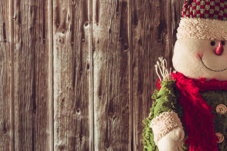 Snowman dressed up in Christmas clothes. Copy space. Selective focus.