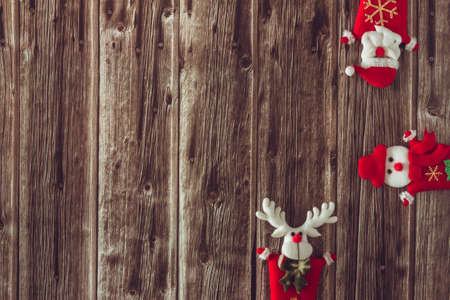 Santa Claus, reindeer and snowman decoration on wood. Copy space. Selective focus.の写真素材
