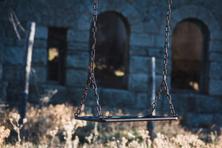 Old swing in abandoned house. Selective focus.の写真素材