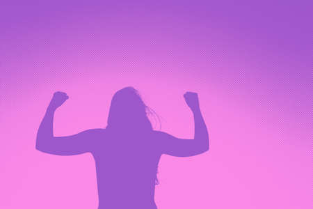 Silhouette of a woman in a position of overcoming, strength and power. Half tone. Copyspace.