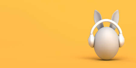 Easter egg with easter bunny ears and headphones. Copyspace. 3D illustration.の写真素材