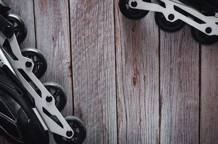 Inline skates on wooden background. Roller. Copyspace. Selective focus.の写真素材