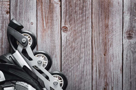 Inline skates on wooden background. Roller. Copyspace. Selective focus.の写真素材