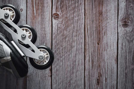 Inline skates on wooden background. Roller. Copyspace. Selective focus.の写真素材