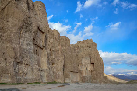 The tombs of Darius the Great and Xerxes the Great, famous rulers of the Achaemenid Empire in ancient Persia, located at Naqsh-e Rostam necropolis near Persepolis in Iranの写真素材