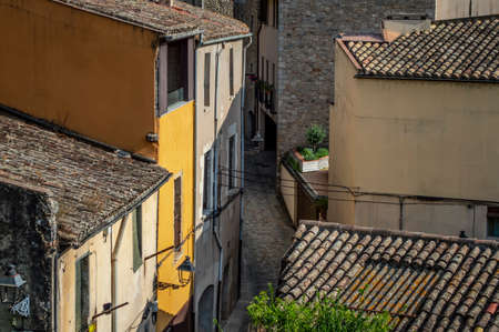 Girona, Spain - July 28, 2019: Tile roofs and empty narrow street with no people in the city of Girona, Catalonia, Spainのeditorial素材