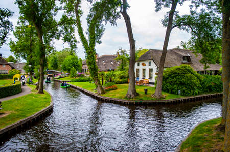 Giethoorn, Netherlands - July 6, 2019: The canals of Giethoorn, a scenic village in the Netherlands, known as the Venice of the Northのeditorial素材