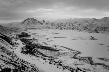 Black and white photo of Azat water reservoir and Yeranos mountain range in Ararat province of Armeniaの写真素材