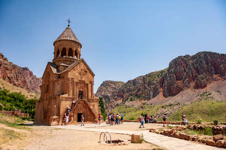 Noravank, Armenia - July 5, 2018: Tourists in front of the Burtelashen church (Church of Holy Mother of God) of the Noravank monastery in Armeniaのeditorial素材