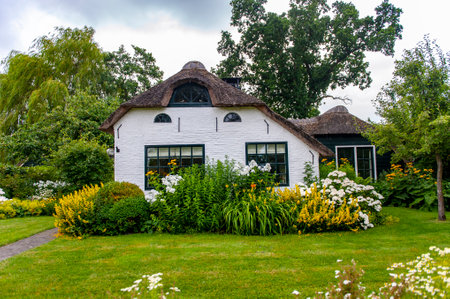 Giethoorn, Netherlands - July 6, 2019: Beautiful rural house in the village of Giethoorn, northeastern Netherlandsのeditorial素材