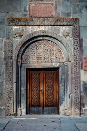 Traditional Armenian ornaments adorning a door at the Geghard monastery in Armeniaの写真素材