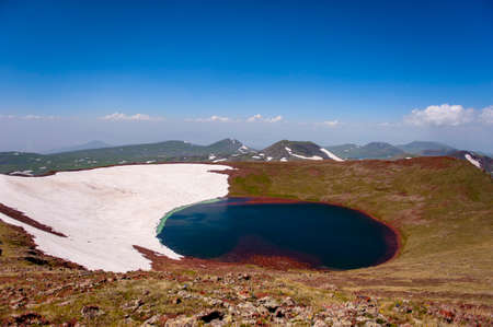 A beautiful crater lake on the summit of mount Azhdahak in Armeniaの写真素材