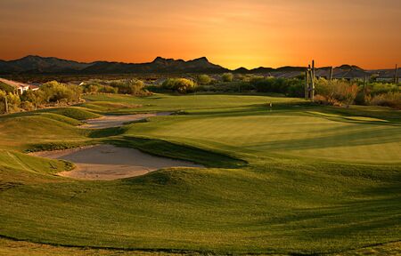 The eighteenth hole at sunset.の写真素材