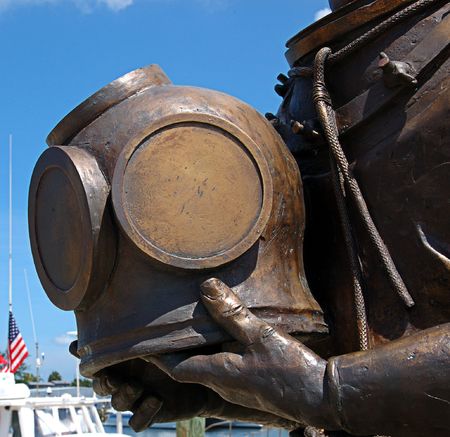 Bronze statue of deep sea diver holding his helmet - makes a good nautical object. 