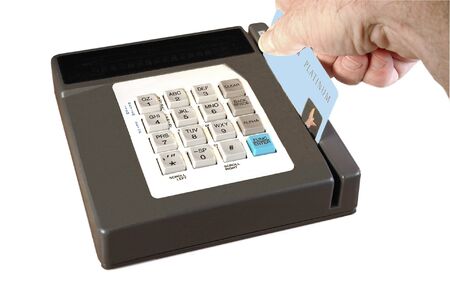 Man swiping Platinum credit card to process a sales transaction, over white.の写真素材