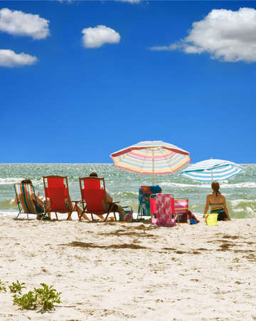 A day at the beach in sunny Florida featuring gentle waves and a bright blue sky の写真素材