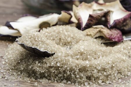 brown cane sugar with silver spoonの写真素材