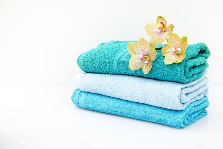 Different arrangement of towels in a set with accessories for the bath and spaの写真素材