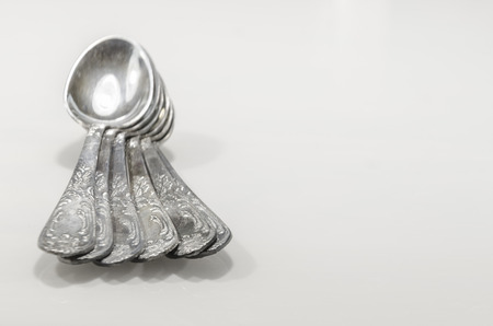 old cutlery on marble table in different posiotions