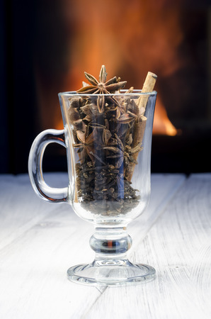 Cup of hot mulled wine with anise, cinnamon and clovesの写真素材