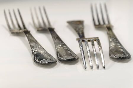 old cutlery on marble table in different posiotionsの写真素材