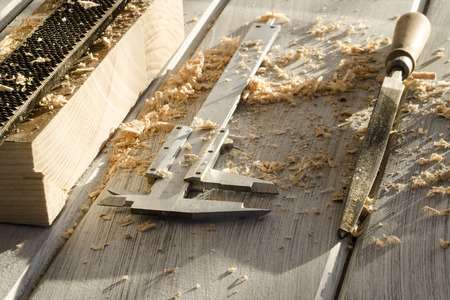 used joiner tool in different positions on wooden table