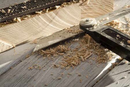 used joiner tool in different positions on wooden table