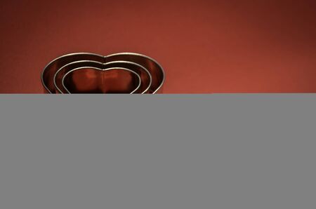 Velentines Card with heart shape on vivid red backgroundの写真素材