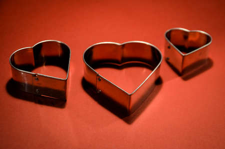 Velentines Card with heart shape on vivid red backgroundの写真素材