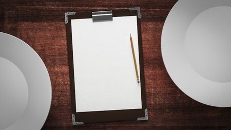 paper and plates on a wooden tableの写真素材