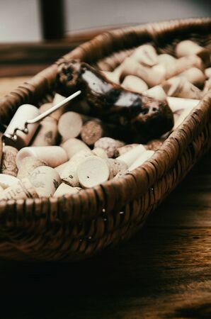 wine corks in a old basket bread on rosewood timber with copy spaceの写真素材