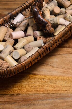 wine corks in a old basket bread on rosewood timber with copy spaceの写真素材