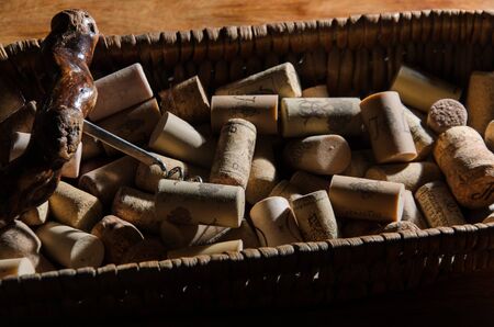 wine corks in a old basket bread on rosewood timber with copy spaceの写真素材