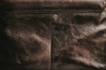 old brown leather bag texture with a visible seam の写真素材