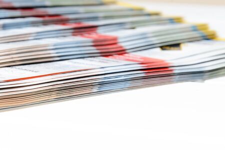 side view of a stack of magazines with glossy paperの写真素材