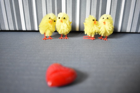 Four synthetic chickens on the stripes backgroundの写真素材