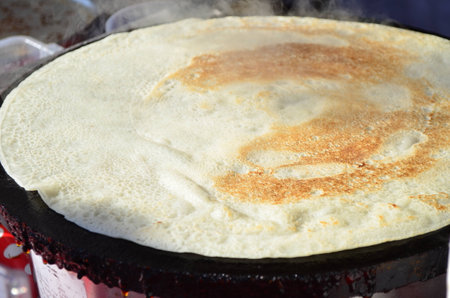 Pancakes cooking in a griddle