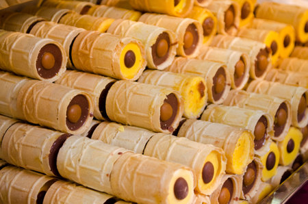 Tasty wafer rolls with chocolate and vanilla creamの写真素材