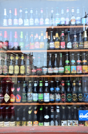 Gent, Belgium - May 16, 2016: Shop window with lots of Belgium beer types. There are approximately 180 breweries in the country, ranging from international giants to microbreweries.のeditorial素材