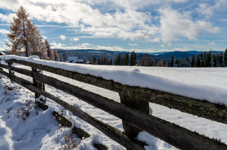 View to a winter landscape with wooden fence, near to Marisel village from Cluj county, Romania.の写真素材