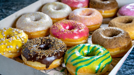 A box filled with lots of colorful donuts box for office brunch. Generative AIの素材