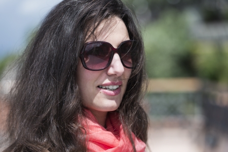 young Italian woman with sunglasses and scarvesの写真素材