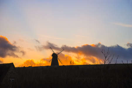 The silhouette of Rottingdean Windmill at sunsetの写真素材